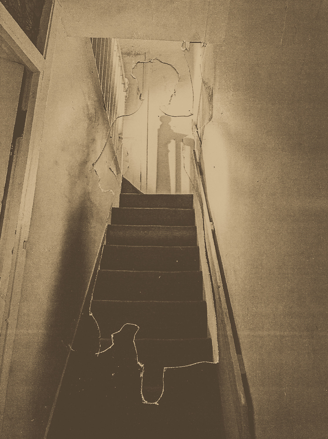 Victorian style photography of a silhouette on a staircase made from cut and pasted paper