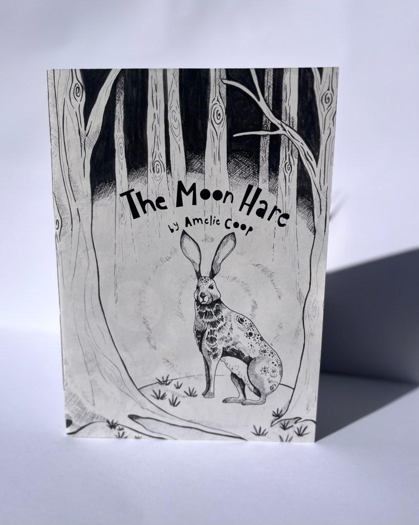 intricately drawn book front cover in black ink, depicting a hare in the woods, and titled 'The moon hare, by Amelie Coop'