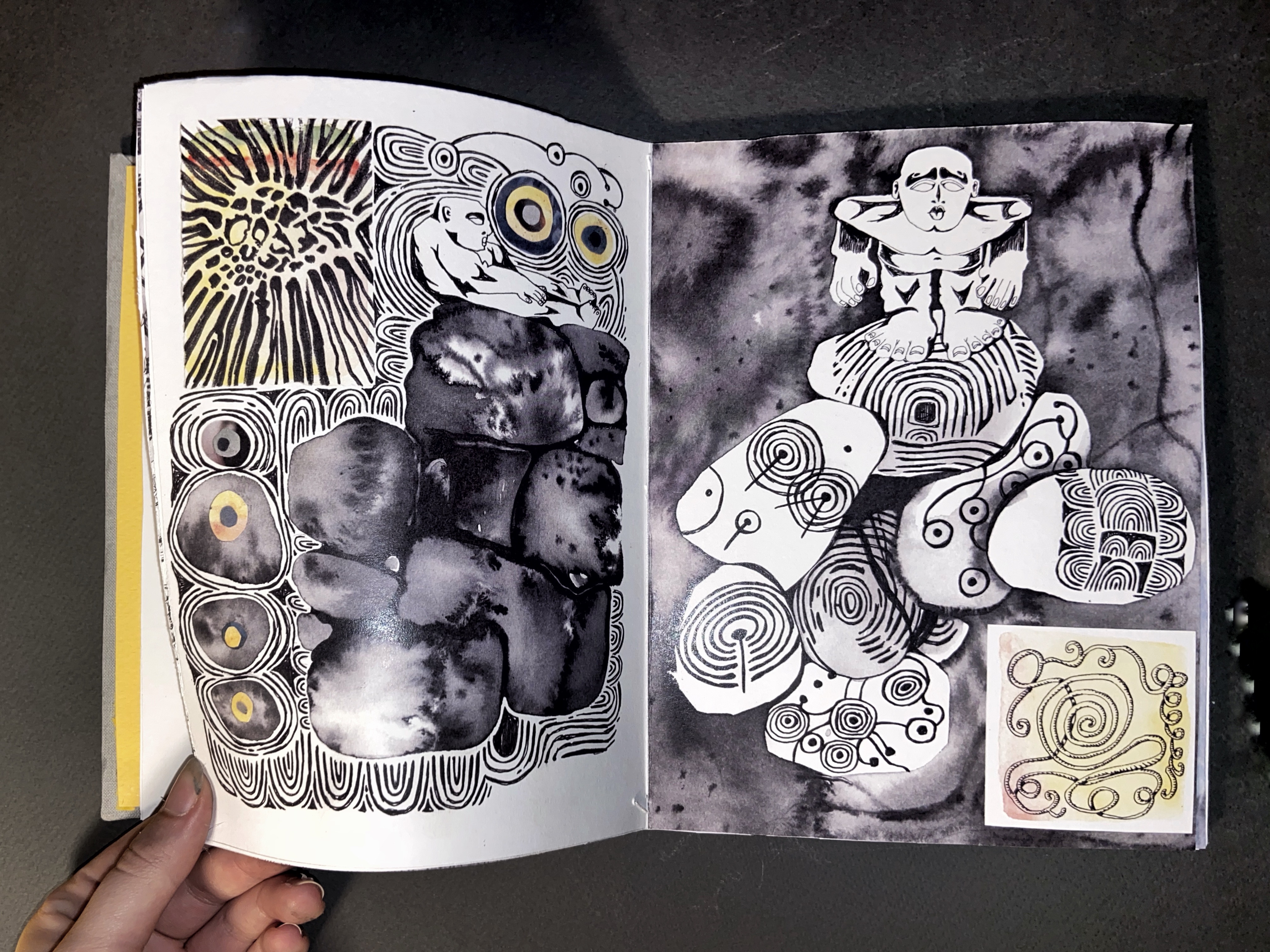 double page spreads from an art book with pen and ink wash drawings of stylised rocks