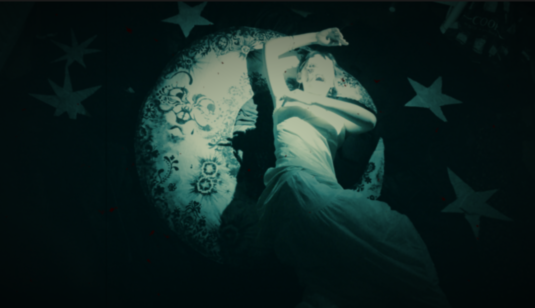 an old fashioned 1920's inspired still, of a woman posed in front of a celestial space background of the moon and stars